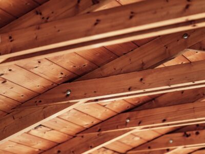 Close-up of exposed wooden roof beams and ceiling boards
